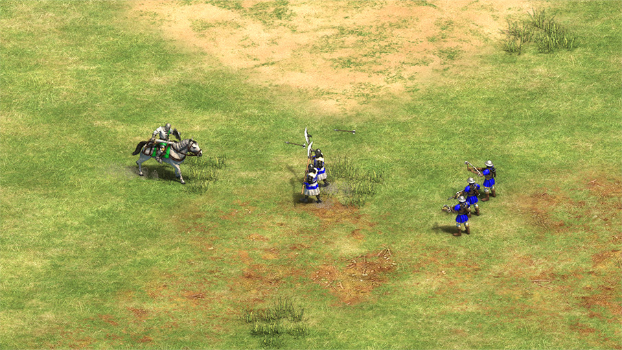 Image of Pikemen attacking a mounted unit, with Archers in the background